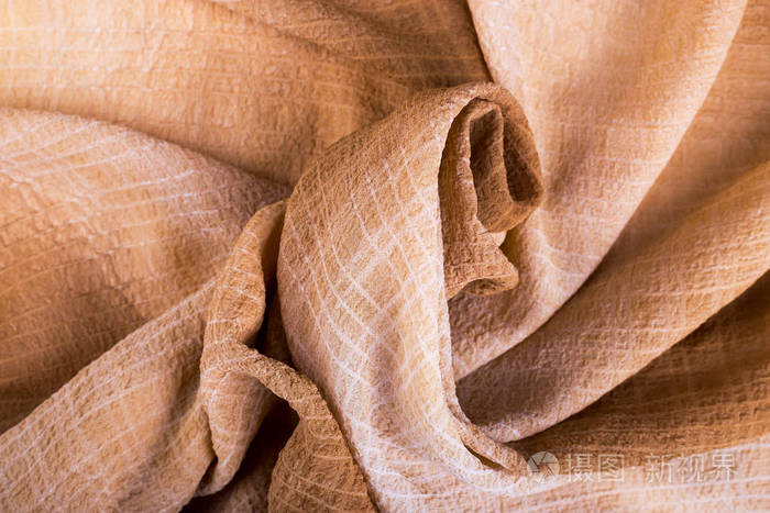 一块米色的布料米色扭曲织物背景