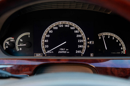 s design with a tachometer and speedometer indicating fuel level