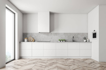 极简主义的厨房内部与白色墙壁，木制地板，阁楼窗口，白色和石头台面，内置水槽和炊具。 3D渲染