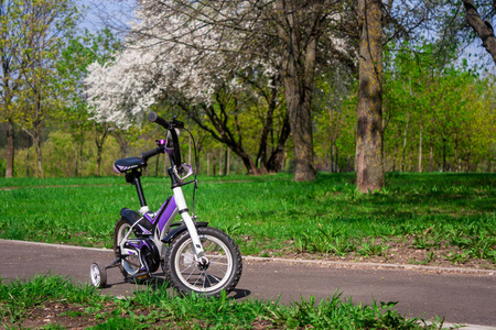 s low twowheeled whitepurple bicycle with extra side wheels st