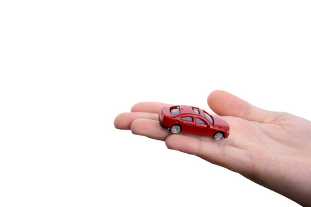 s hand holding a red car on a white background