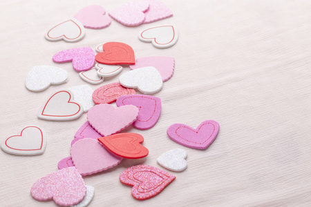 s day background of multicolored hearts on the table