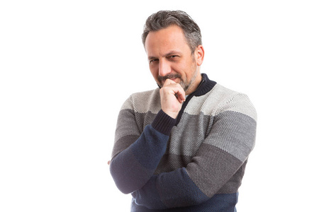 有专注表情的人,摸着下巴,在白色背景下孤立地思考或计划照片