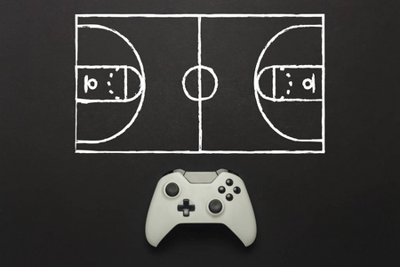 黑色背景上的白色游戏垫。 增加了一个篮球场方案。 比赛的战术。 概念游戏篮球在控制台电脑游戏。 平躺式顶部视图