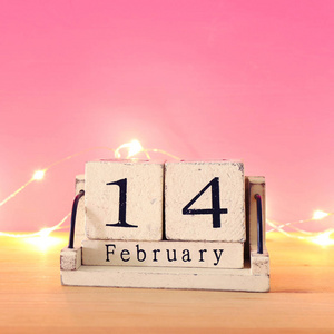 s day background. Vintage wooden calendar with 14th february dat
