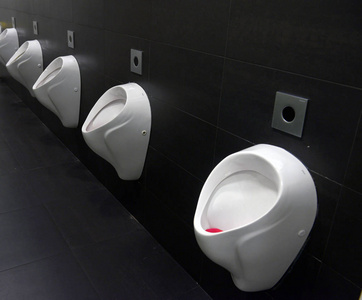 s bathroom design of white ceramic urinals for men in toilet roo