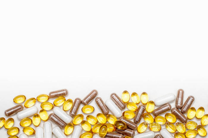 什锦药物药片和胶囊药丸背景一堆各种各样的药片和药丸不同颜色的白色