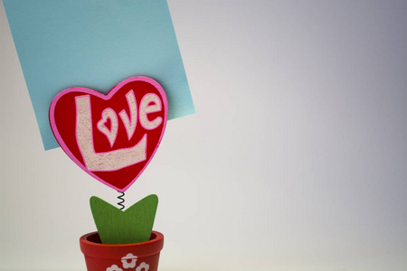 s Day. Red wooden heart with the inscription 34