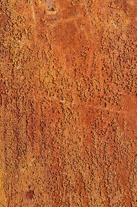 一张生锈的旧铁金属片的背景，橙色和棕色