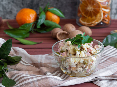 s salad in a glass bowl, on a towel on a wooden table