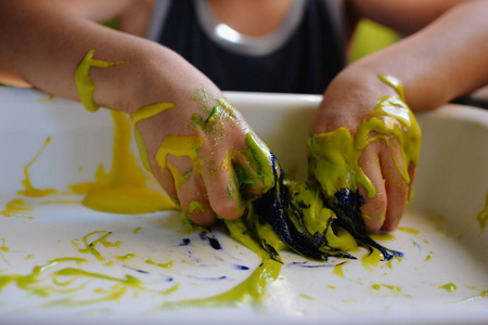 S HANDS PLAYING WITH HANDMADE GALACTIC SLIME