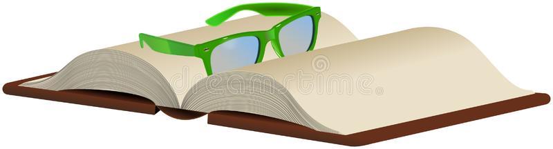 打开的书上戴着绿色的眼镜