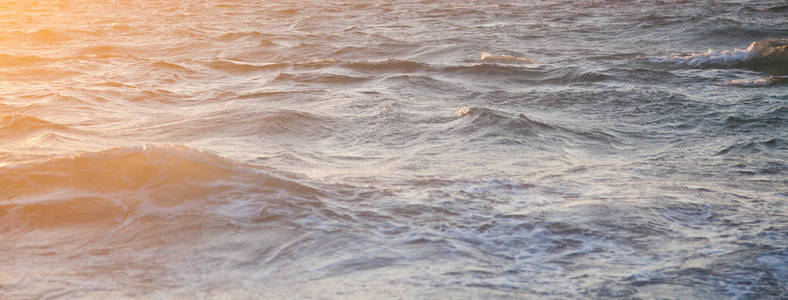 美丽的海浪日落海滩度假背景