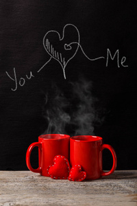 s Day Concept with Heart, You, Me drawing on a chalkboard