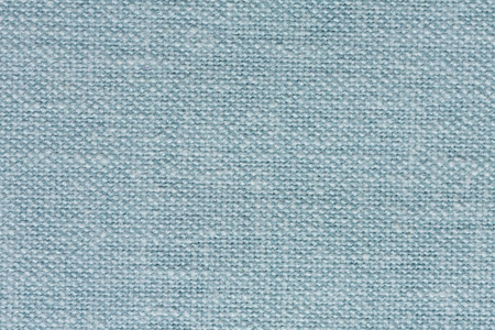 奇妙的浅蓝色纺织背景。 高分辨率照片。