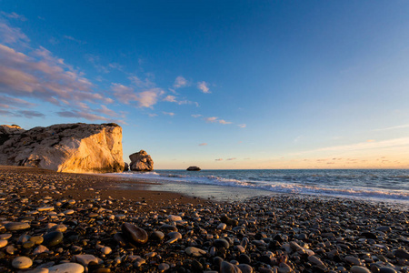 s rock on stone beach during susnet. Landscape taken on Cyprus i