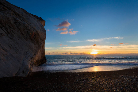 s rock on stone beach during susnet. Landscape taken on Cyprus i