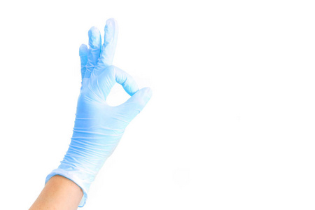 女性手在白色医疗手套显示好的标志