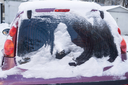 s windscreen wiper covered in snow