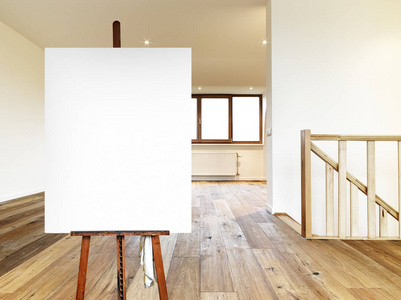 s easel and empty canvas in a modern interior with wooden floor