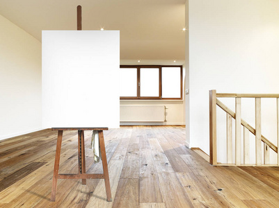 s easel and empty canvas in a modern interior with wooden floor