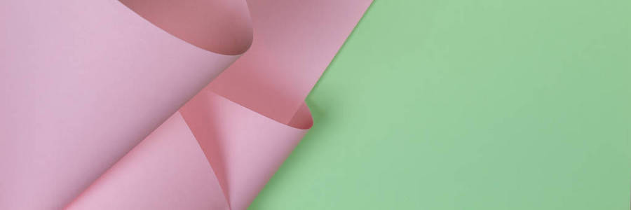 抽象几何形状柔和的粉红色和绿色的纸背景