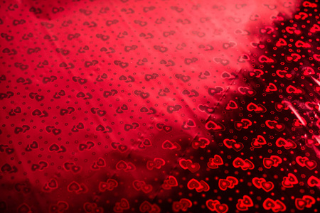 s Day or a wedding. Background with a pattern in hearts on wrapp