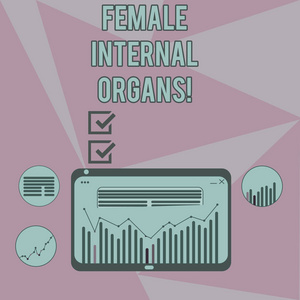 显示女性内脏器官的书写笔记。商业照片展示平板屏幕上柱线数据图形图数字组合的内部生殖器结构