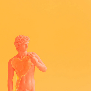 蒸汽波风格的塑料糊状橙色大卫. 圣瓦伦丁日心卡照片