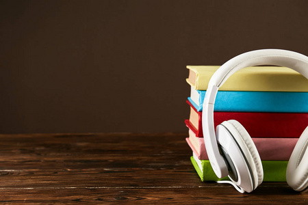  white headphones on table. Old versus new. Close up, copy space