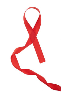 白色背景上的红色支撑丝带。 世界艾滋病日概念。