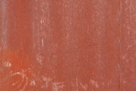 金属纹理背景与红色磨损油漆和许多小生锈粗糙的点。