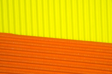 黄色和橙色瓦楞纸纹理用于背景。 生动的颜色与复制空间，以添加文本或对象。