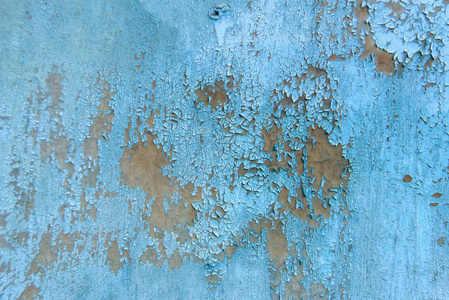 开裂涂料的质感..墙是蓝色的。防锈干漆..粉刷过的墙。旧油漆。裂缝表面。