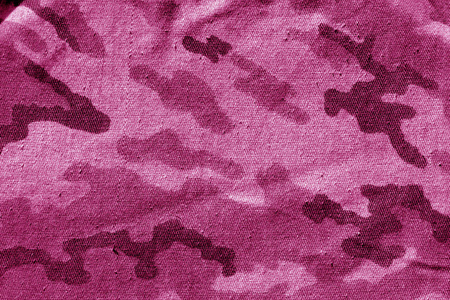 粉红色的脏迷彩布。 设计ABD思想的抽象背景和纹理。