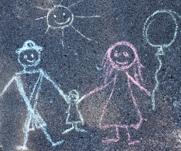 s drawing with chalk on the pavement, the family