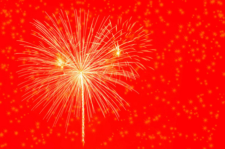 烟火. 红色背景上的星星和闪亮的烟花.