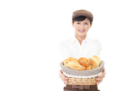 一个微笑的女面包师图片