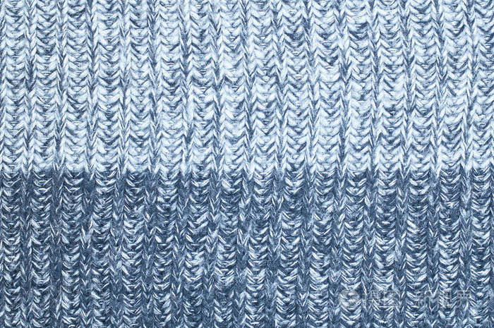 毛衣重复机器编织纹理. 米色针织背景.