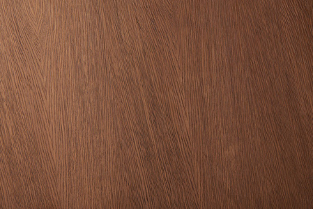 木质书桌棕色书桌表面的顶部视图,木质纹理照片