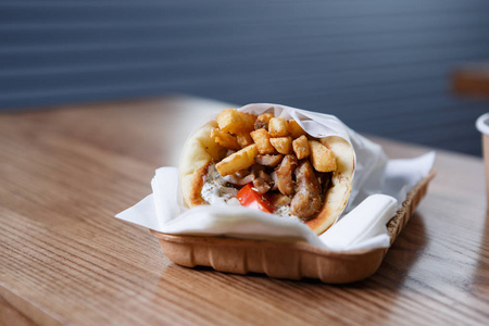  gyros meat sandwich dish from Greece served in paper plate.Tast