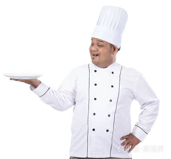 亚洲厨师的姿势肖像服务的东西与他的手