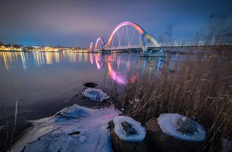 s pedestrian bridge with pink luminescence, Sweden