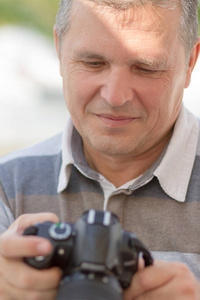  son having fun, while their dad is taking photos with his DSLR 