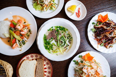  boiled beef meat.Plates with different vegetable salads amp