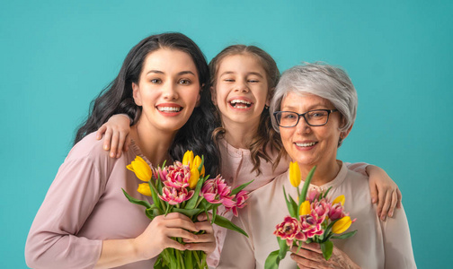 s day Child daughter is congratulating mom and grandma giving t