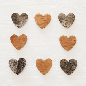 s day concept. hearts cutted from tree trunk over wooden white b