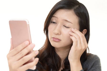 有眼睛疲劳的女人照片