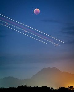 一张罕见的照片，2019年1月超级血狼月食上升在瓦胡岛夏威夷，从飞机上的一个山景。