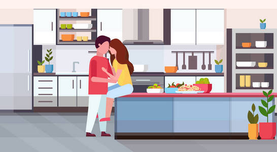 情侣拥抱和亲吻在厨房柜台快乐情人节庆祝概念男人女人在爱拥抱现代公寓内部平的水平